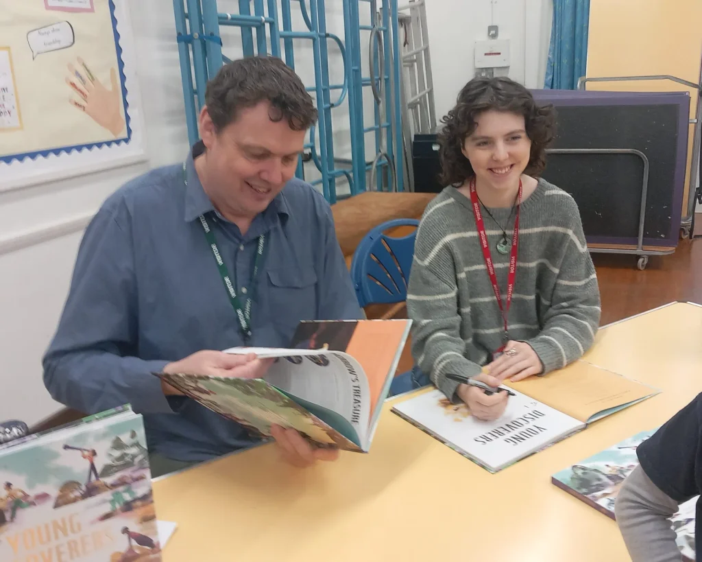 Stephen Davies and Daisy Morris signing copies of Young Discoverers