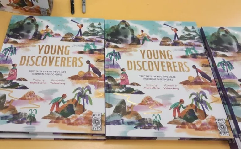 Copies of Young Discoverers on a table