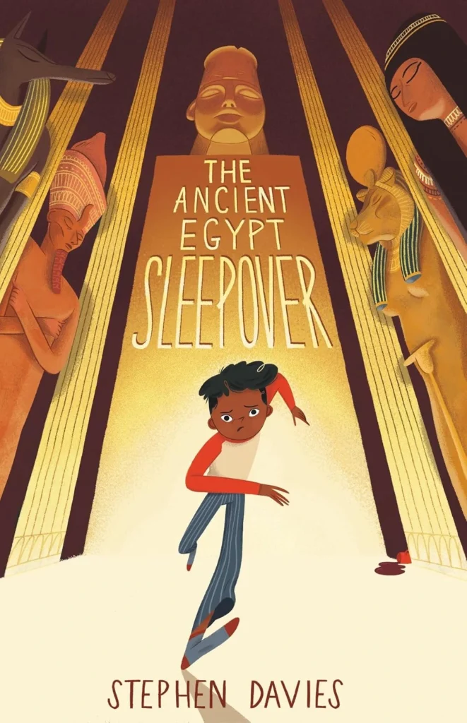 Front cover of The Ancient Egypt Sleepover by Stephen Davies, showing a boy running through the British Museum