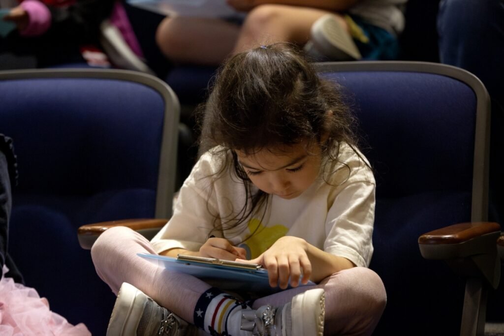 young writer engrossed in her writing